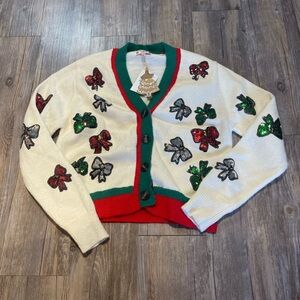 Poof! Cream Cardigan with Red and Green Bow Accents